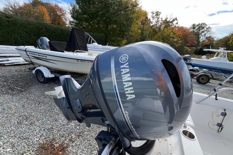 Slide: The Image of Boston Whaler 16 Dauntless 2001 with Yamaha outboard motor in a boatyard. - 21