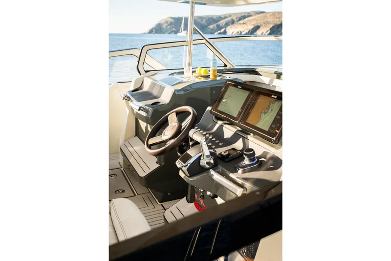Slide: The Image of Interior of 2026 YOT 36 boat with modern navigation system and steering wheel. - 13