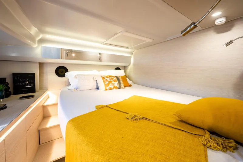 Slide: The Image of Luxurious YOT 36 yacht bedroom interior, 2026 model, with cozy bedding and modern lighting. - 15