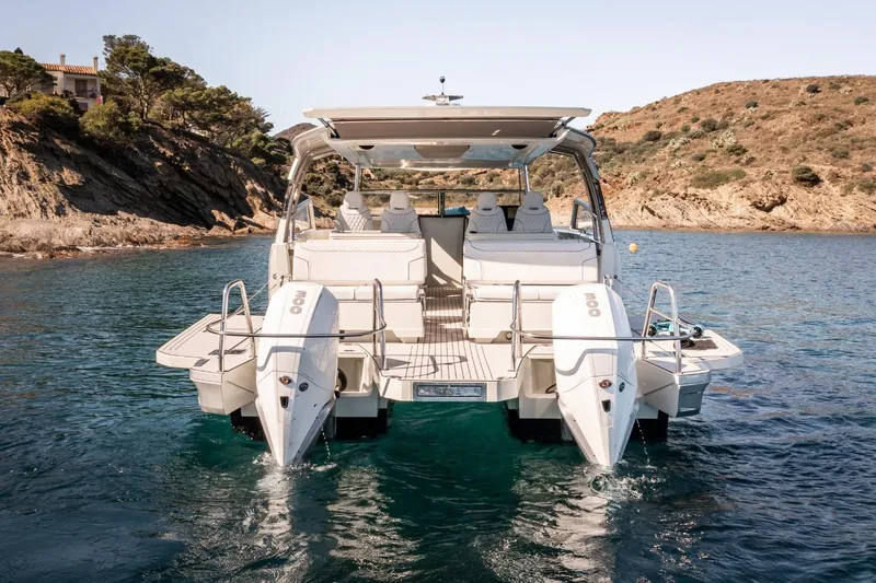 Slide: The Image of Luxury YOT 36 boat, 2026 model, anchored in scenic coastal waters. - 5