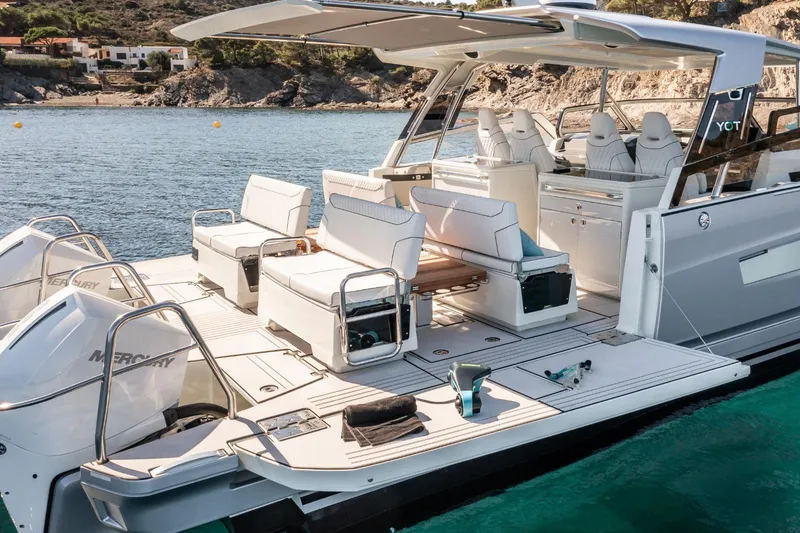 Slide: The Image of Luxurious 2026 YOT 36 yacht with spacious deck and modern seating on serene waters. - 6