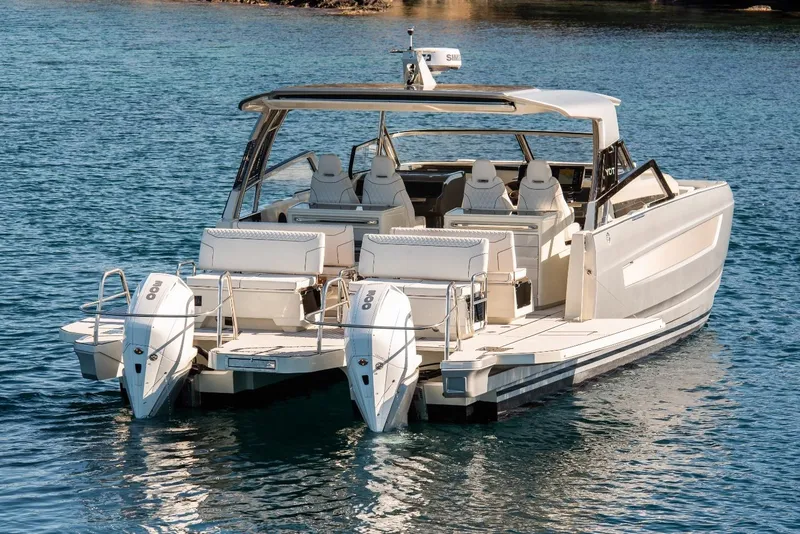 Slide: The Image of Luxury YOT 36 boat, 2026 model, with dual engines on calm water. - 7