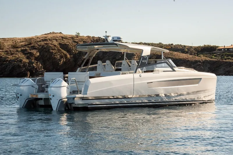 Slide: The Image of Luxury YOT 36 boat on water, 2026 model, sleek design, scenic background. - 8
