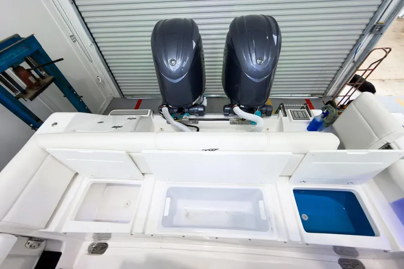 Slide: The Image of 2026 Tidewater 256 LXF boat with dual engines and open storage compartments. - 11