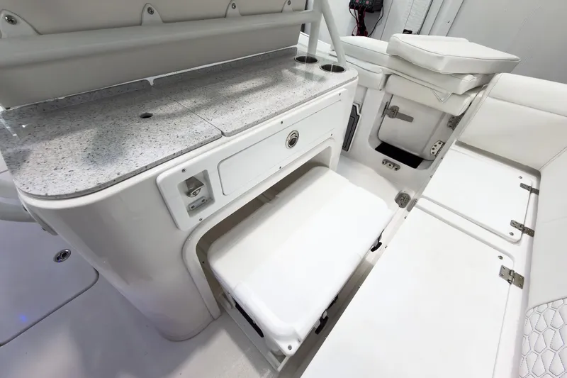 Slide: The Image of 2026 Tidewater 256 LXF boat interior with storage compartments and seating. - 22