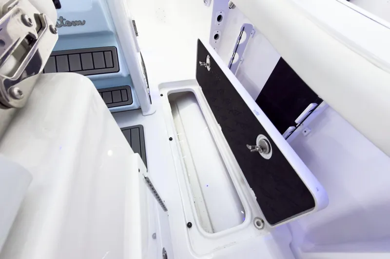 Slide: The Image of 2026 Tidewater 256 LXF boat interior storage compartment with sleek design and modern features. - 26