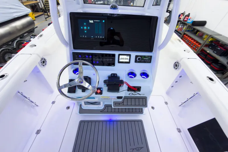 Slide: The Image of 2026 Tidewater 256 LXF boat cockpit with modern steering and control panel. - 35