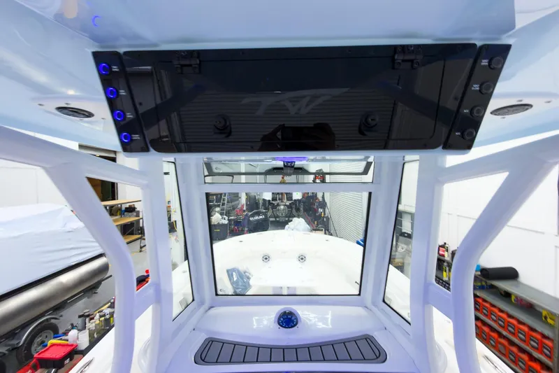 Slide: The Image of 2026 Tidewater 256 LXF boat interior with modern dashboard and controls. - 39