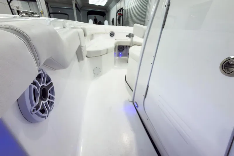 Slide: The Image of 2026 Tidewater 256 LXF boat interior with white seating and modern design. - 42