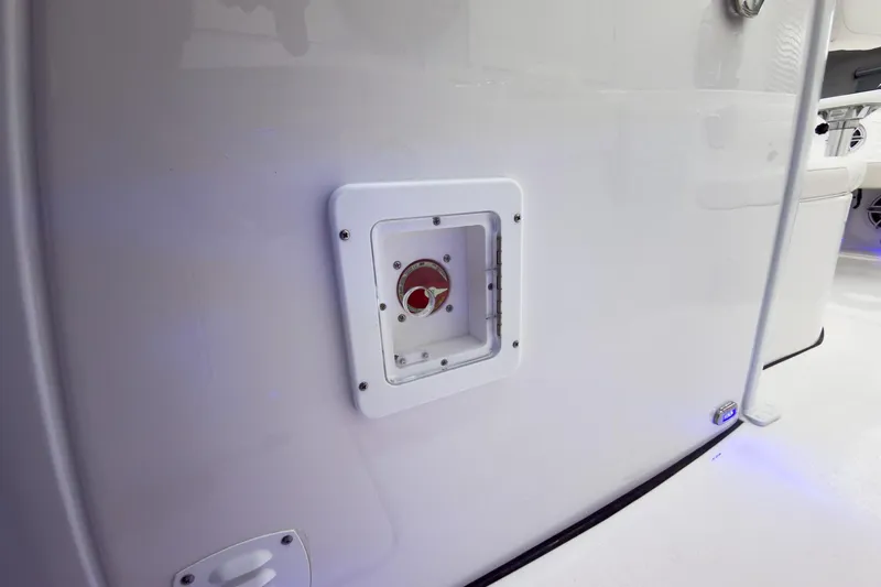 Slide: The Image of 2026 Tidewater 256 LXF boat interior detail with access panel and sleek design. - 45
