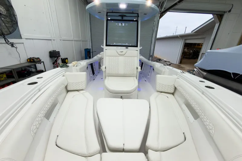 Slide: The Image of 2026 Tidewater 256 LXF boat interior with white seating and modern design. - 56