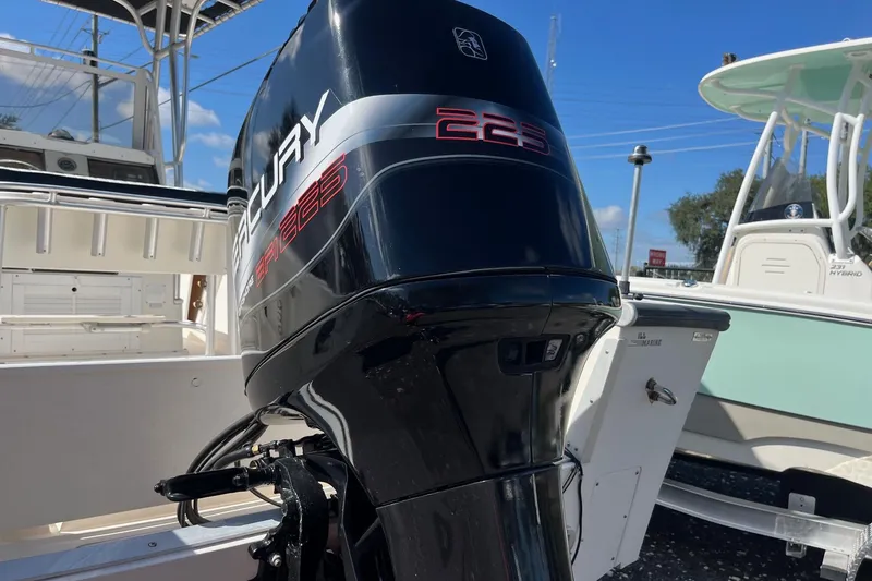 Slide: The Image of Outboard motor on a 1995 Mako 248 boat, featuring a Mercury 225 engine. - 9