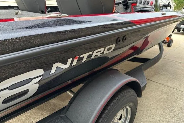 Slide: The Image of 2023 Nitro Z18 Pro boat on trailer, showcasing sleek design and branding. - 4