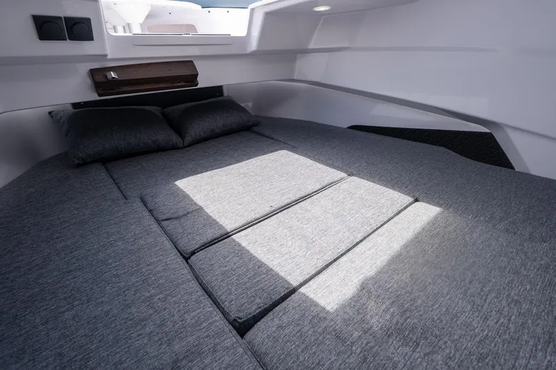 Slide: The Image of Interior cabin of 2026 Axopar 29 Cross Cabin with a comfortable bed setup. - 22