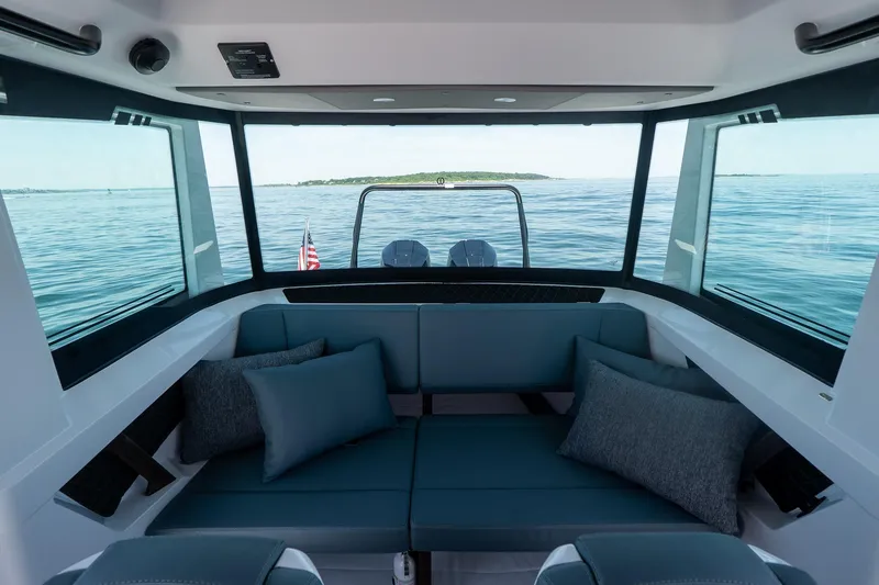 Slide: The Image of Interior view of 2026 Axopar 29 Cross Cabin with ocean backdrop. - 40