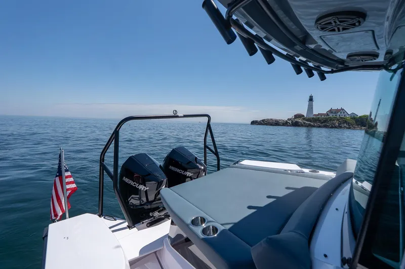 Slide: The Image of 2026 Axopar 29 Cross Cabin boat near lighthouse on calm sea. - 45