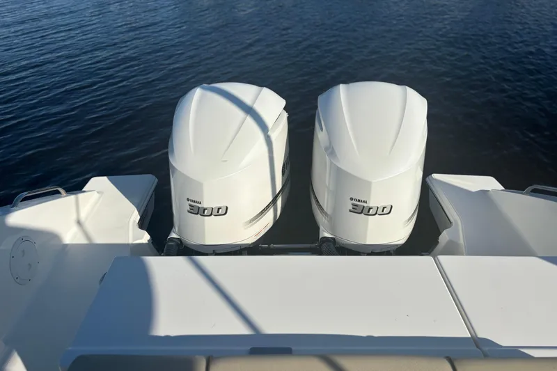 Slide: The Image of 2020 Pursuit DC 295 Dual Console with twin Yamaha 300 engines on water. - 15