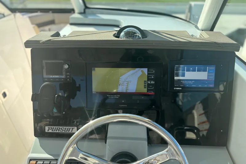 Slide: The Image of 2020 Pursuit DC 295 Dual Console dashboard with navigation and control displays. - 9