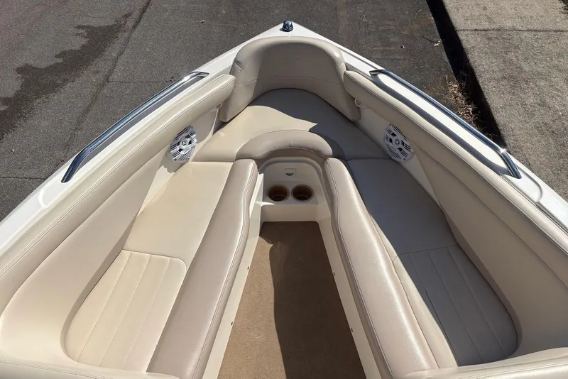 Slide: The Image of 2003 MasterCraft MariStar 230 SV boat interior with beige seating and cup holders. - 12