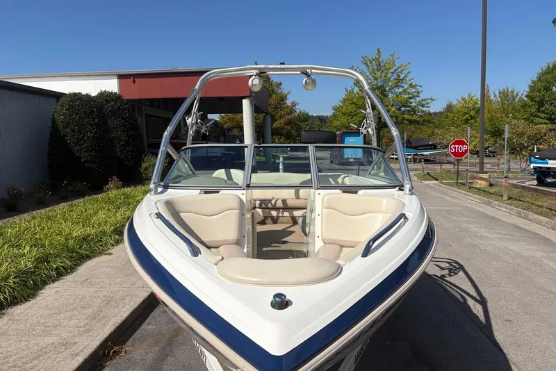 Slide: The Image of 2003 MasterCraft MariStar 230 SV boat parked outdoors on a sunny day. - 5