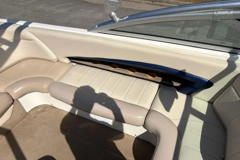 Slide: The Image of 2003 MasterCraft MariStar 230 SV boat interior with beige seating and cup holders. - 7