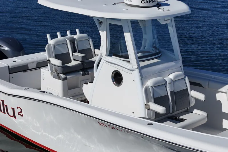 Slide: The Image of 2018 Tidewater 280 CC Adventure boat with dual seating, on calm water. - 14