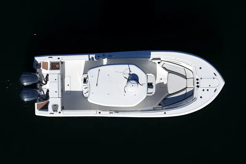 Slide: The Image of Overhead view of 2018 Tidewater 280 CC Adventure boat on dark water. - 16