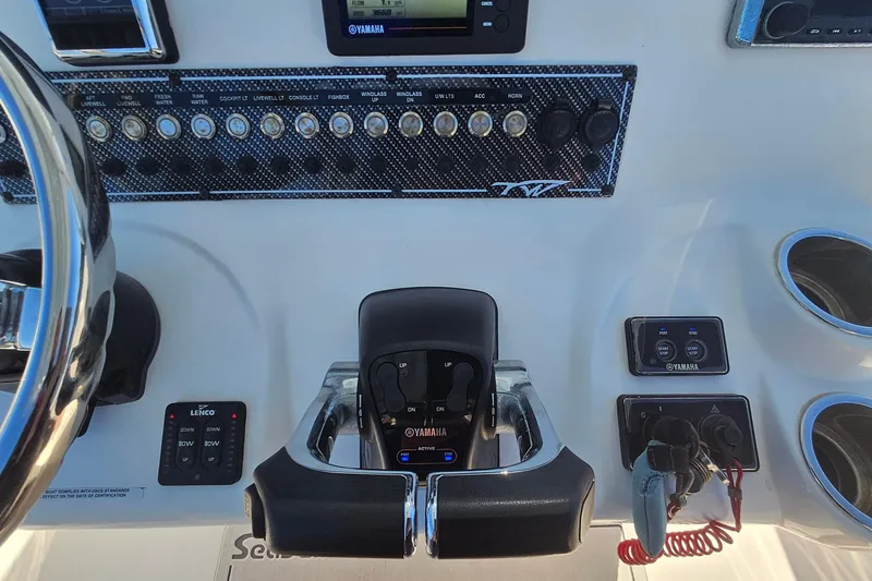 Slide: The Image of Control panel of 2018 Tidewater 280 CC Adventure boat with Yamaha throttle and switches. - 32