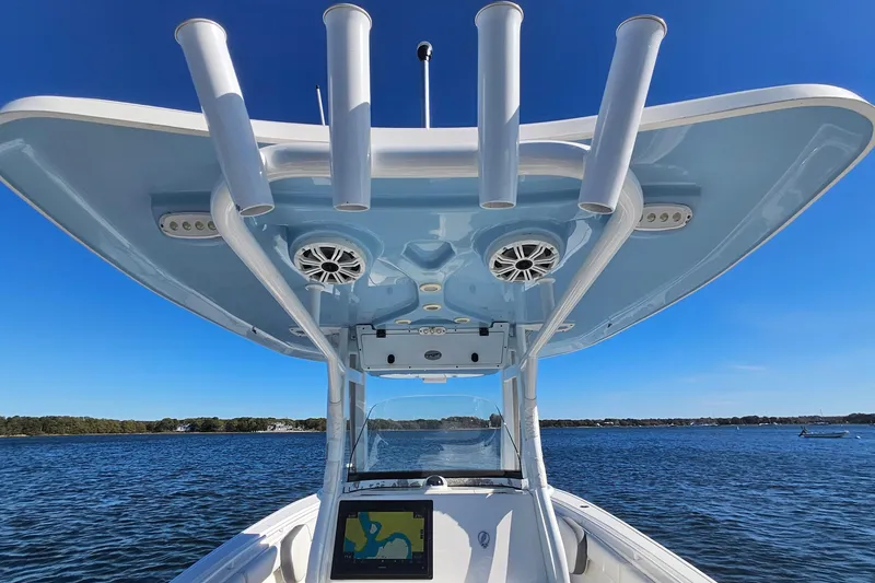 Slide: The Image of 2018 Tidewater 280 CC Adventure boat with T-top and navigation system on open water. - 33