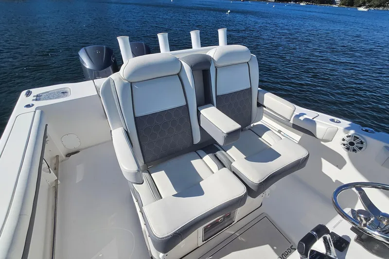 Slide: The Image of 2018 Tidewater 280 CC Adventure boat interior with comfortable seating and ocean view. - 35