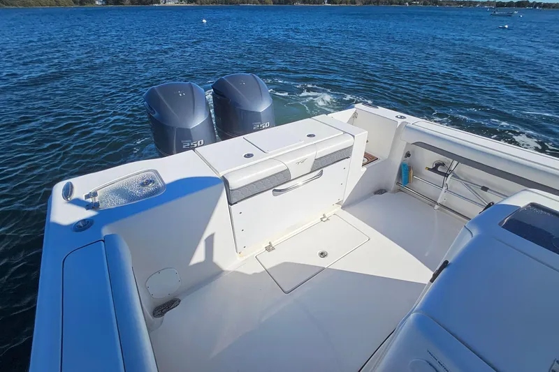 Slide: The Image of 2018 Tidewater 280 CC Adventure boat with dual 250 engines on open water. - 39