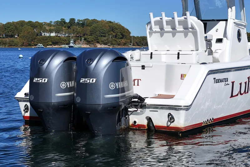 Slide: The Image of 2018 Tidewater 280 CC Adventure boat with dual Yamaha 250 engines on water. - 7