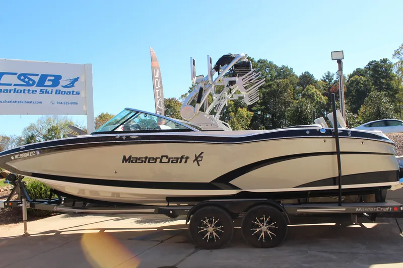 Slide: The Image of 2016 MasterCraft X26 boat on trailer at Charlotte Ski Boats dealership. - 7