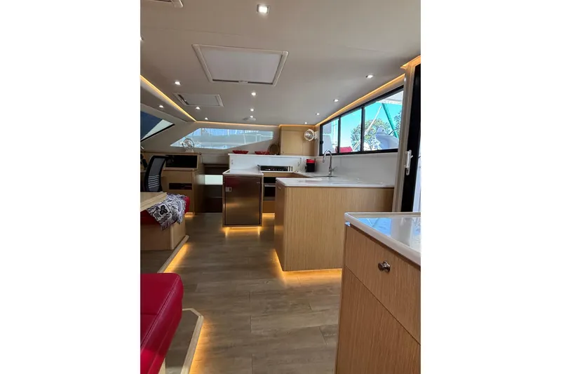 Slide: The Image of Luxurious interior of 2022 Seawind 1600 catamaran with modern kitchen and ambient lighting. - 14