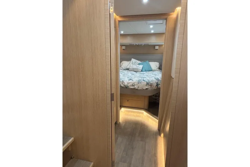 Slide: The Image of Luxurious interior of 2022 Seawind 1600 catamaran with cozy bedroom and modern lighting. - 26