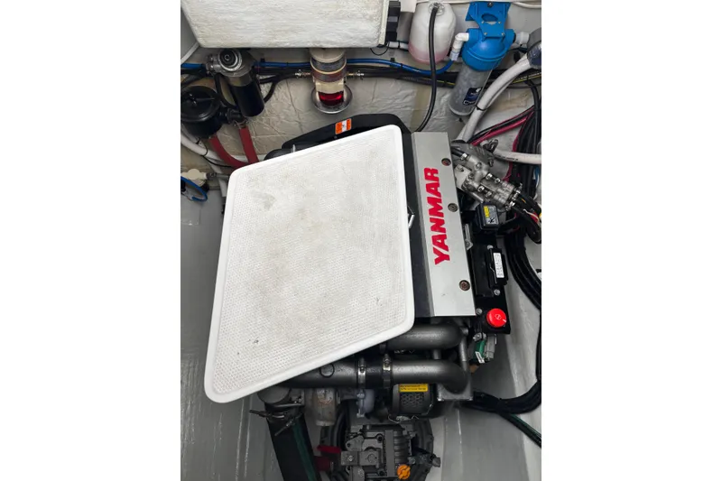 Slide: The Image of Engine compartment of a 2022 Seawind 1600 catamaran featuring a Yanmar engine. - 31
