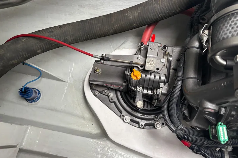 Slide: The Image of Engine compartment of a 2022 Seawind 1600, showcasing mechanical components and wiring. - 32