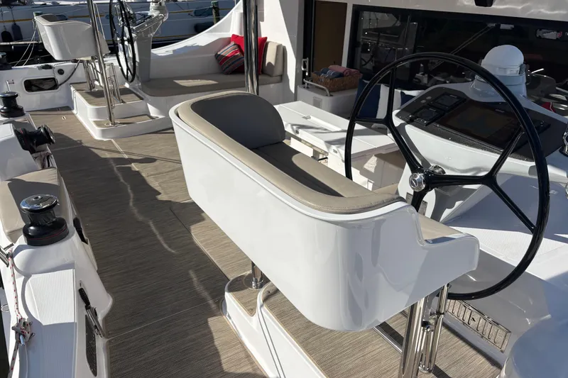 Slide: The Image of 2022 Seawind 1600 yacht cockpit with modern steering and seating area. - 5