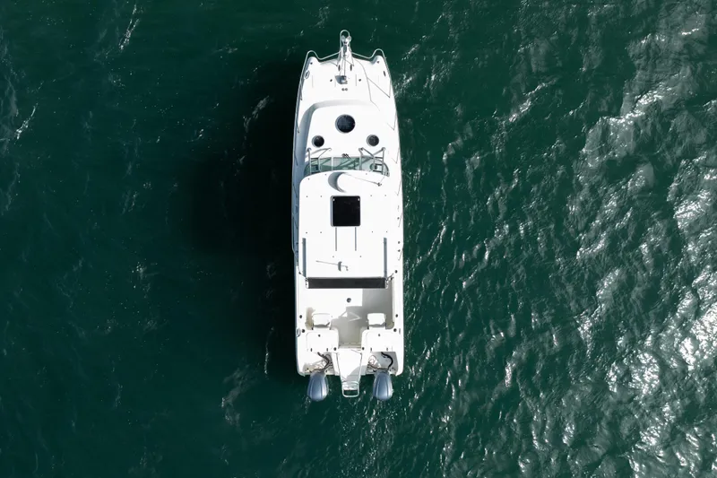 Slide: The Image of Aerial view of 2017 World Cat 320 EC boat on open water. - 12