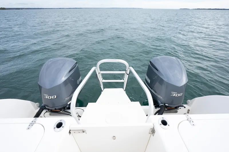 Slide: The Image of 2017 World Cat 320 EC boat with twin Yamaha 300 engines on open water. - 13