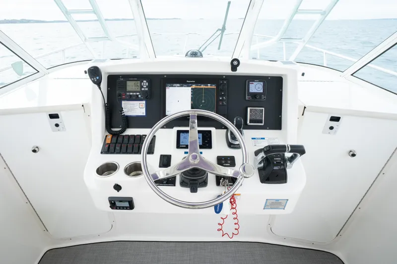 Slide: The Image of Helm of 2017 World Cat 320 EC boat with navigation and control systems. - 25
