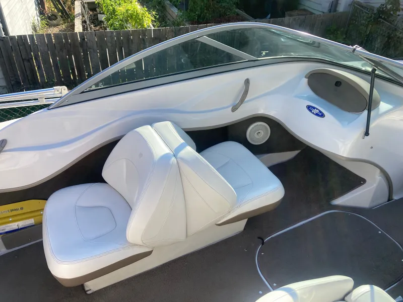 Slide: The Image of 2008 Four Winns 180 Horizon boat interior with white seating and sleek design. - 13