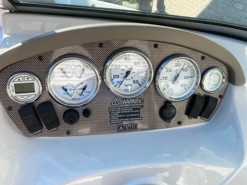 Slide: The Image of Dashboard of a 2008 Four Winns 180 Horizon boat with gauges and controls. - 17