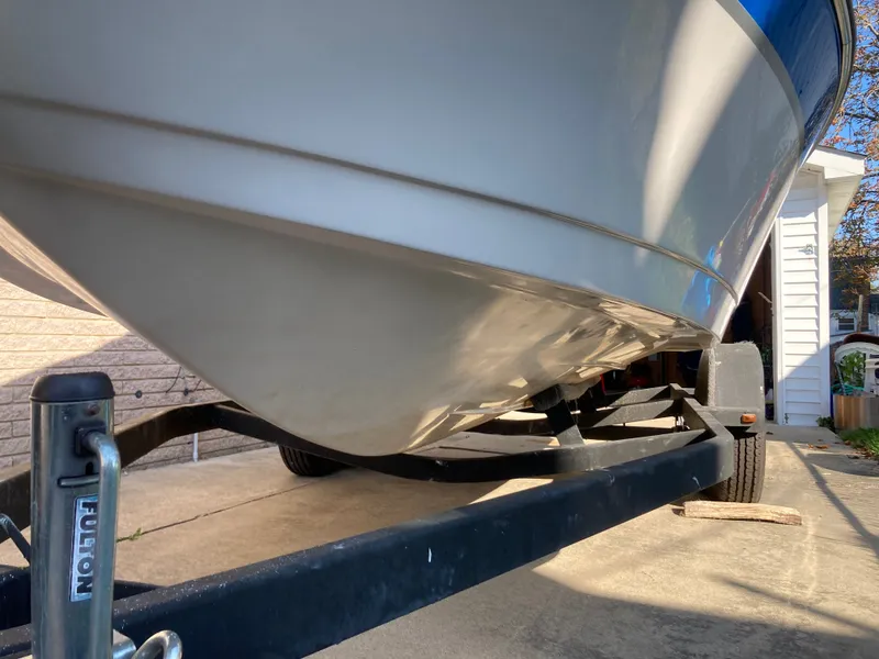 Slide: The Image of 2008 Four Winns 180 Horizon boat on trailer, parked in driveway. - 22