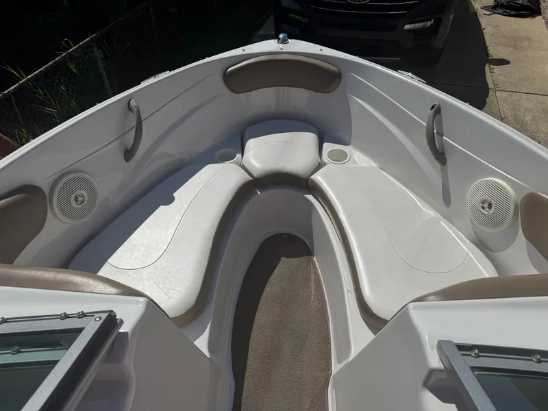 Slide: The Image of 2008 Four Winns 180 Horizon boat interior with white seating and cup holders. - 7