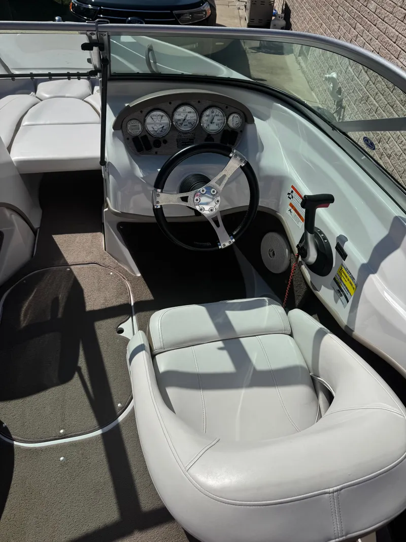 Slide: The Image of 2008 Four Winns 180 Horizon boat interior with steering wheel and gauges. - 8