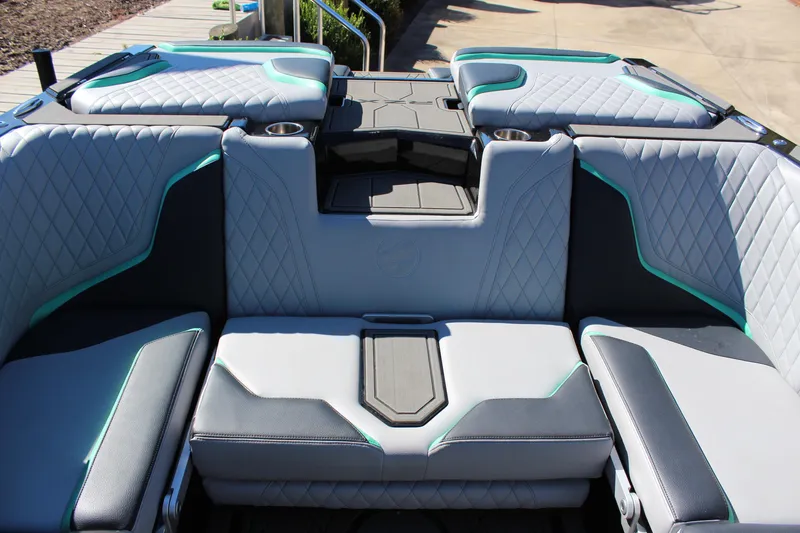 Slide: The Image of 2023 Tigé 24RZX boat interior with luxurious seating and cup holders. - 10