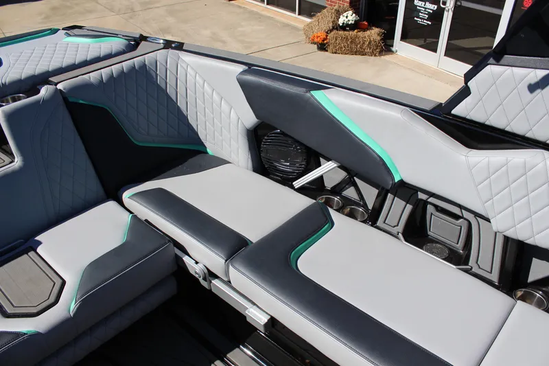 Slide: The Image of 2023 Tigé 24RZX boat interior with stylish gray and teal seating. - 11