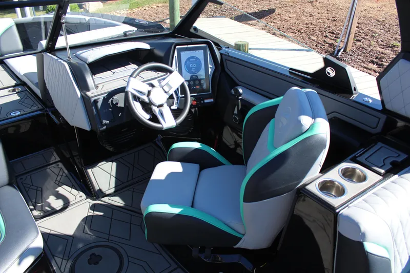 Slide: The Image of 2023 Tigé 24RZX boat interior with modern dashboard and comfortable seating. - 13