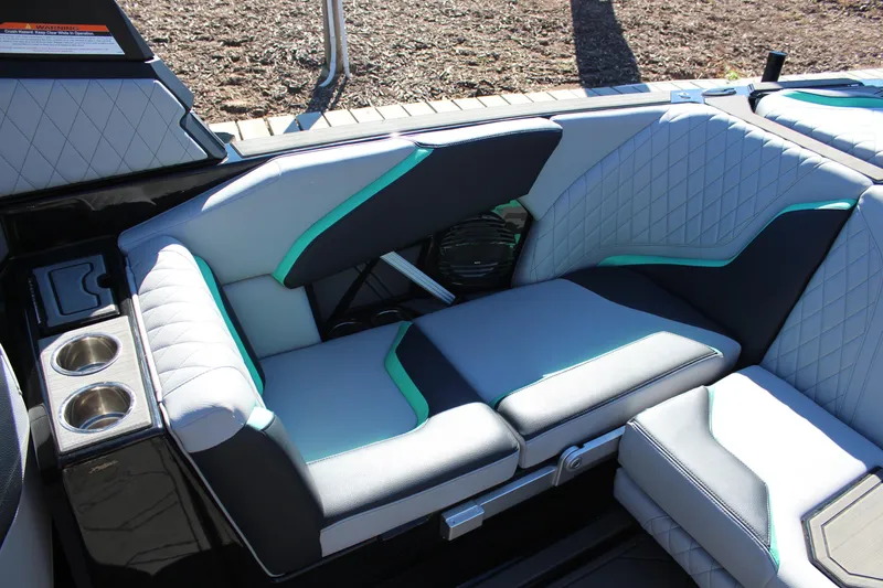 Slide: The Image of 2023 Tigé 24RZX boat interior with stylish seating and cup holders. - 9